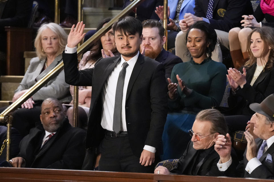 Brandon Tsay, who disarmed the accused gunman in a mass shooting last month in California, is recognized by President Joe Biden as he delivers the State of the Union address to a joint session of Congress, at the Capitol in Washington, Tuesday, Feb. 7, 2023. (AP Photo/Patrick Semansky)