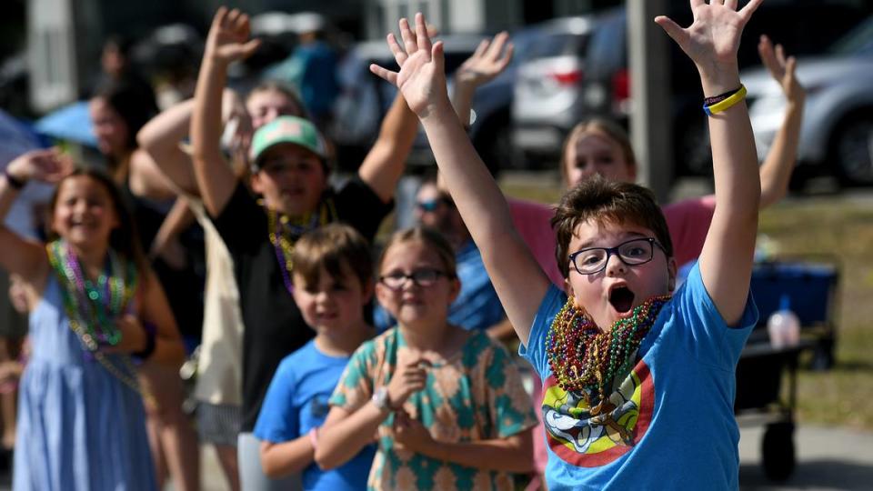 Children cheer and yell for beads during the Hernando DeSoto Historical Society’s Children’s Parade on Friday, April 7, 2023 in Palmetto. Tiffany Tompkins/ttompkins@bradenton.com