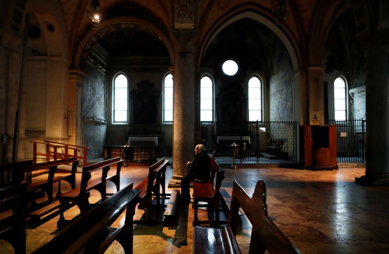A man sits in Santa Maria delle Grazie church, in Milan