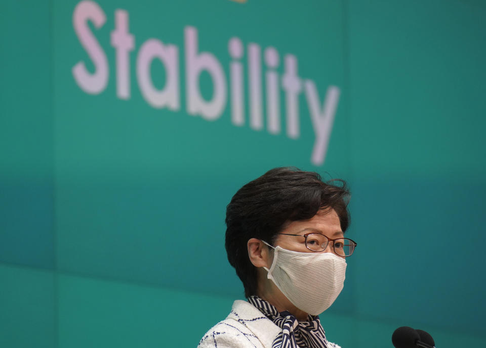 Hong Kong Chief Executive Carrie Lam listens to reporters questions during a press conference in Hong Kong, Tuesday, June 16, 2020. Lam urged people to support a controversial national security law to be imposed by Beijing, while at the same time confessing that she couldn't explain the details of it.(AP Photo/Vincent Yu)