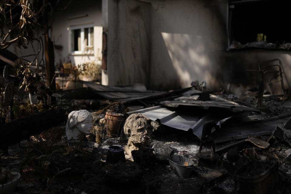 Parts of statues lie among debris in a home that came under attack during a massive Hamas invasion into Kibbutz Nir Oz, Israel, Thursday, Oct. 19, 2023. Nir Oz is one of more than 20 towns and villages in southern Israel that were ambushed in the sweeping assault by Hamas on Oct. 7. About 100 of Nir Oz's 400 people are dead or missing. (AP Photo/Francisco Seco)