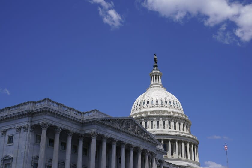 FILE - The sun shines on the dome of Capitol Hill in Washington, Friday, Aug. 12, 2022. A man drove his car into a barricade near the U.S. Capitol early Sunday, Aug. 14, 2022, and then began firing gunshots in the air from the burning car before fatally shooting himself, police said. (AP Photo/Susan Walsh, File)