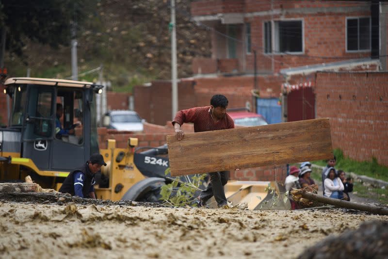 River flooding due to rain affects homes, in La Paz