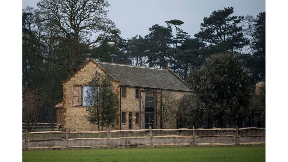 Large farmhouse in wooded area