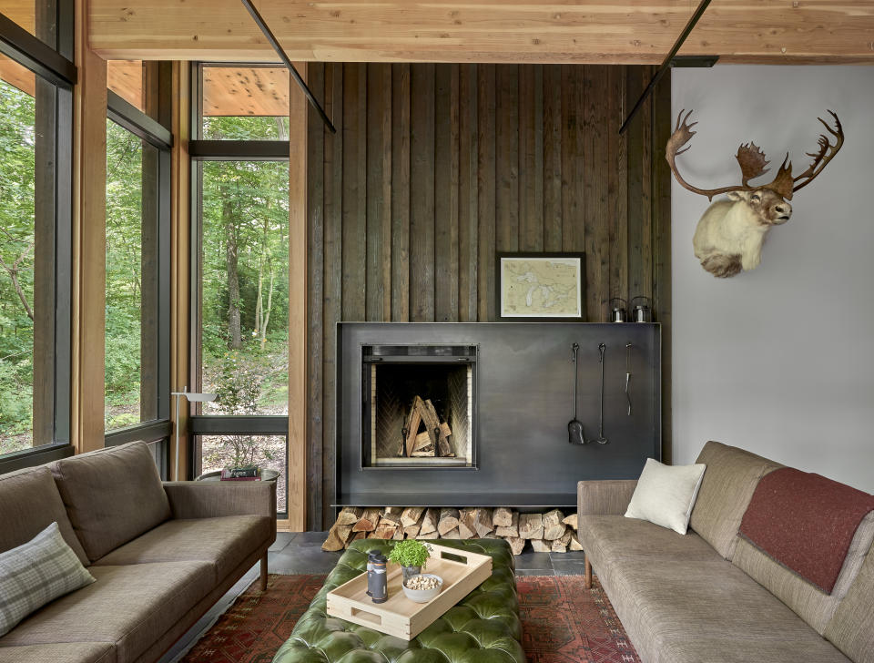 A living room with a small fireplace