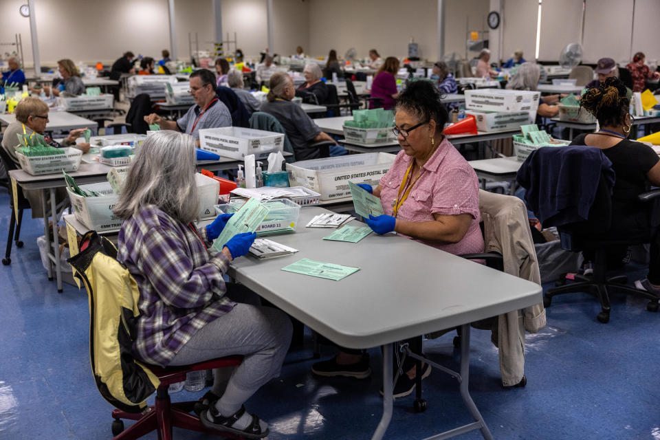 PHOENIX, ARIZONA - NOVEMBER 09:  Election workers sort ballots at the Maricopa County Tabulation and Election Center on November 09, 2022 in Phoenix, Arizona.  / Credit: John Moore / Getty Images