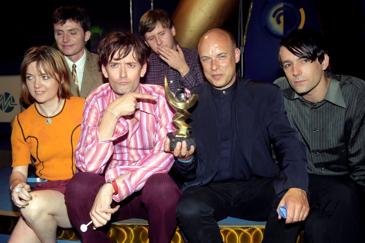 Pulp with Brian Eno, second right, after winning the Mercury Prize in 1996 (PA)