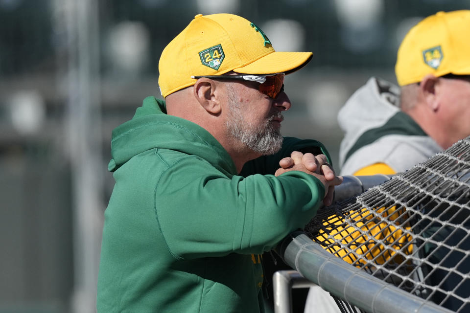 Oakland Athletics manager Mark Kotsay watches batting practice during a baseball spring training workout, Friday, Feb. 16, 2024, in Mesa, Ariz. (AP Photo/Matt York)