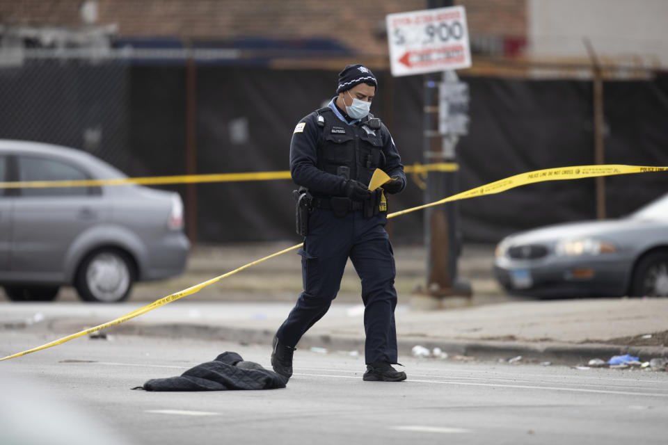 Chicago police work the scene of a fatal shooting early Sunday, March 14, 2021, in the Park Manor neighborhood of Chicago. Authorities say gunfire erupted at a party on Chicago’s South Side early Sunday morning. (Erin Hooley /Chicago Tribune via AP)