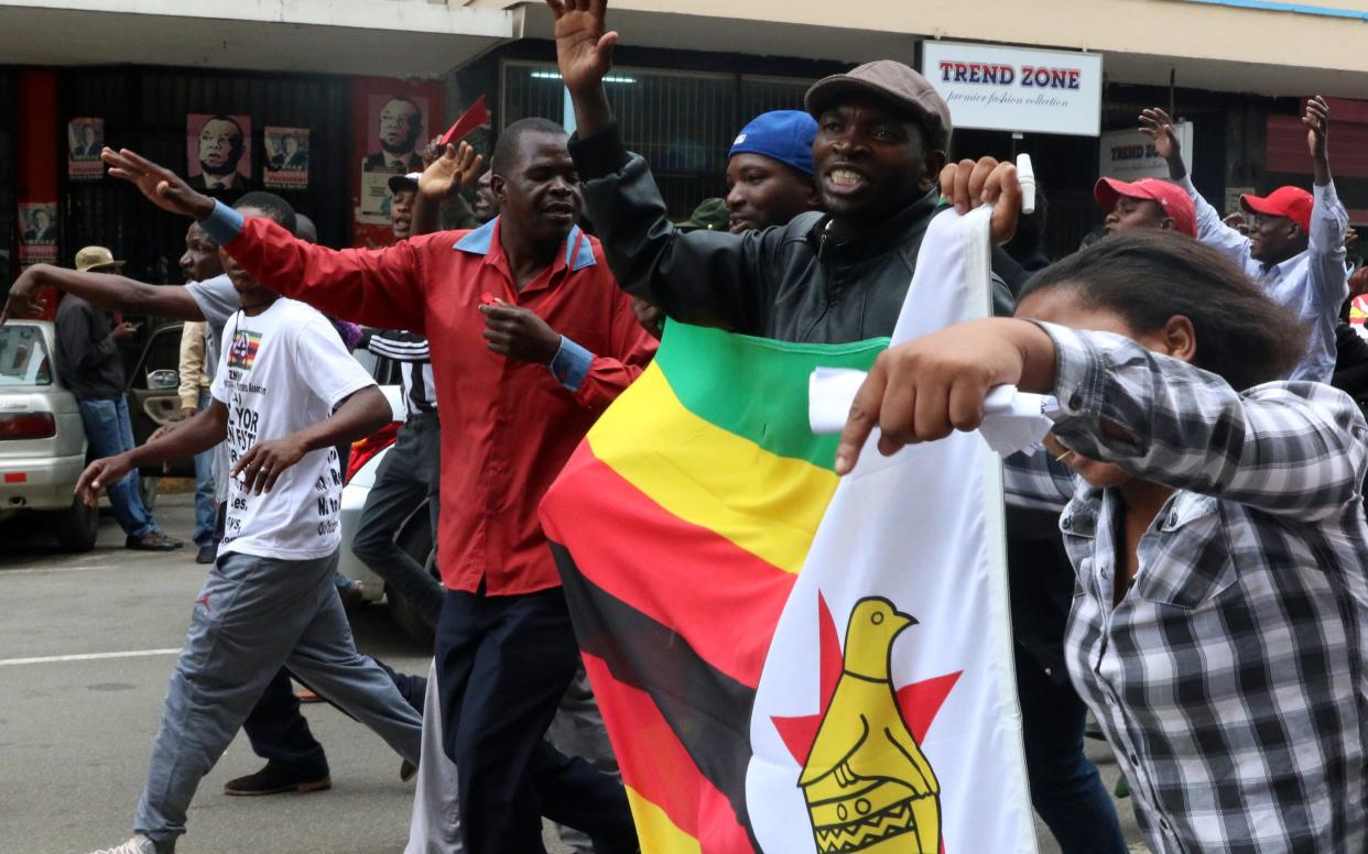 Protesters gather calling for Zimbabwean President Robert Mugabe to step down, -  PHILIMON BULAWAYO