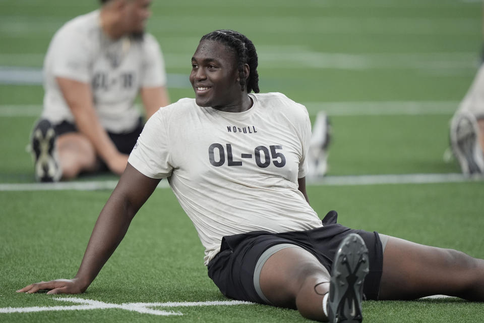 Houston offensive lineman Patrick Paul smiles during a drill in the Big 12 NCAA college NFL football pro day Saturday, March 30, 2024, in Frisco, Texas. (AP Photo/LM Otero)