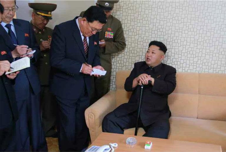 North Korean leader Kim Jong-Un (R), seen during an inspection tour of a newly-built housing complex in Pyongyang, in October 2014