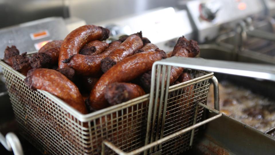 A basket of sausages after coming out of the deep fryer at Helen's Sausage House.