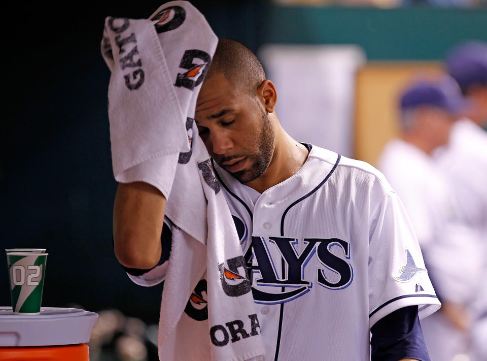 ST. PETERSBURG - JUNE 13: Pitcher David Price #14 of the Tampa Bay Rays wipes his face after he left the game against the New York Mets at Tropicana Field on June 13, 2012 in St. Petersburg, Florida. (Photo by J. Meric/Getty Images)