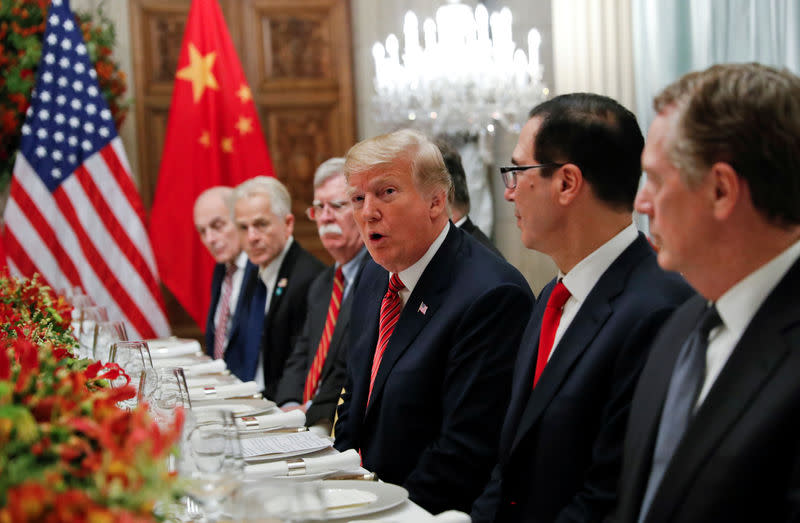 U.S. President Donald Trump, U.S. President Donald Trump’s national security adviser John Bolton, U.S. Treasury Secretary Steven Mnuchin attend a working dinner with Chinese President Xi Jinping after the G20 leaders summit in Buenos Aires, Argentina December 1, 2018. REUTERS/Kevin Lamarque