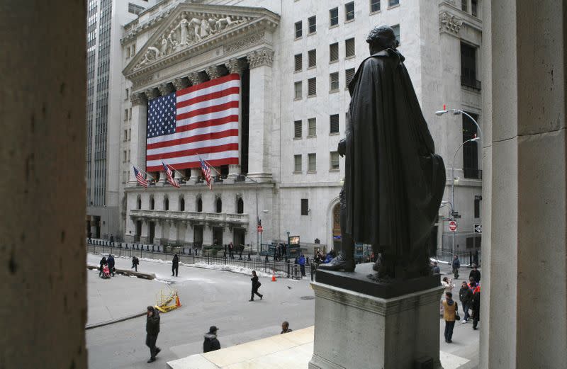 FILE PHOTO: A statue of George Washington is seen on Wall St. across the New York Stock Exchange