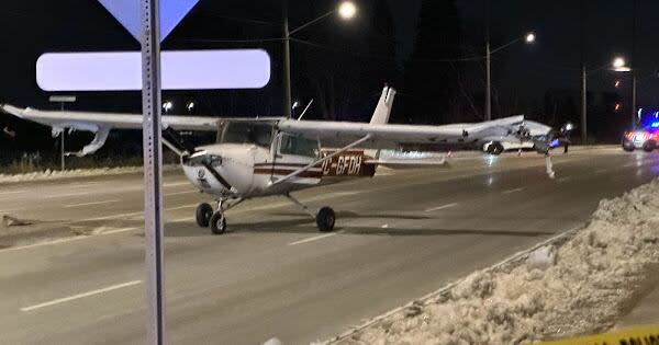 A small plane is shown here after it made an emergency landing on an Ajax, Ont., street on Monday night. (Submitted by Darshan - image credit)