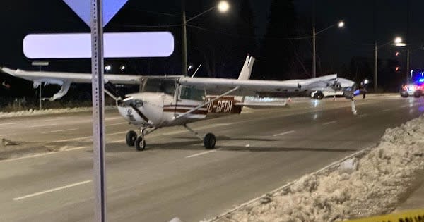 A small plane is shown here after it made an emergency landing on an Ajax street on Monday night. (Submitted by Darshan - image credit)