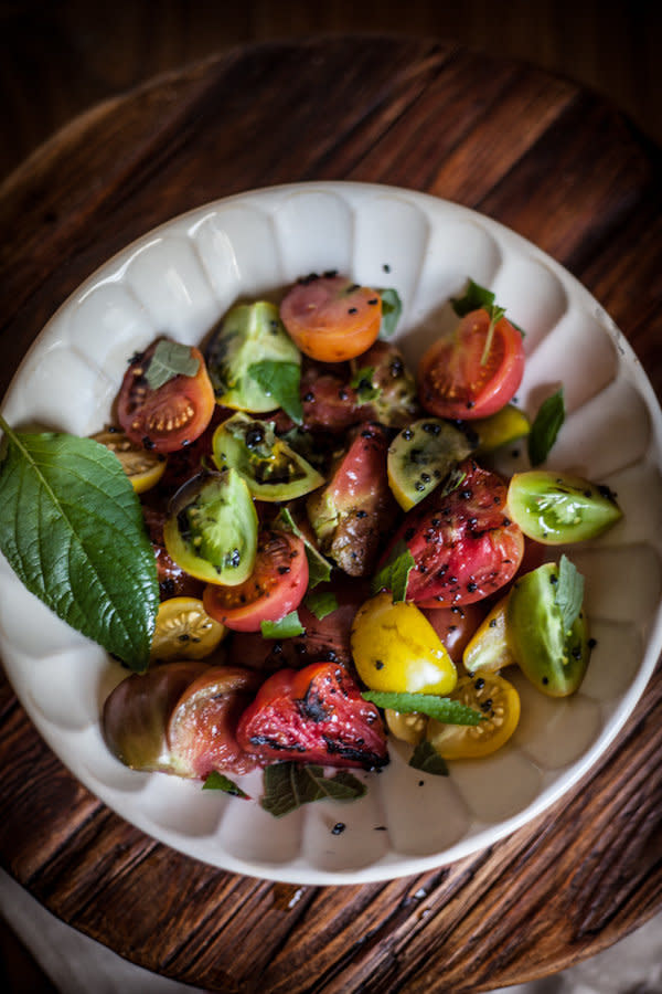 <strong>Get the <a href="http://www.adventures-in-cooking.com/2013/06/red-wine-burgers-with-mushrooms-goat.html" target="_blank">Simple Tomato Salad recipe</a>&nbsp;from Adventures in Cooking</strong>