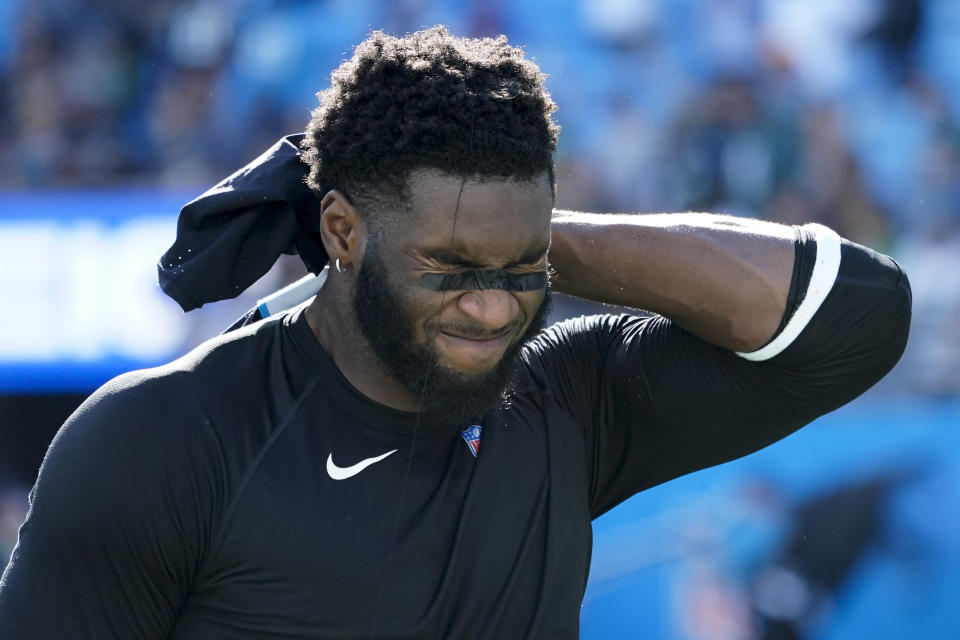 Carolina Panthers defensive end Brian Burns leaves the field after their loss against the Philadelphia Eagles in an NFL football game Sunday, Oct. 10, 2021, in Charlotte, N.C. (AP Photo/Jacob Kupferman)