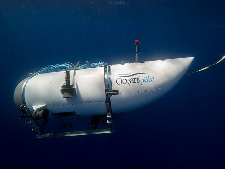 A side view of the Titan submersible in water.