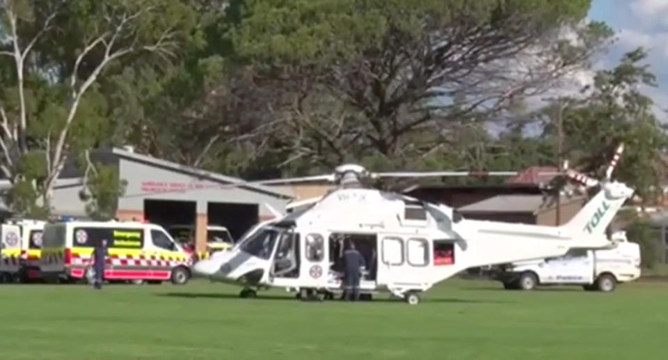 A helicopter lands next to an ambulance in Wellington, NSW. 