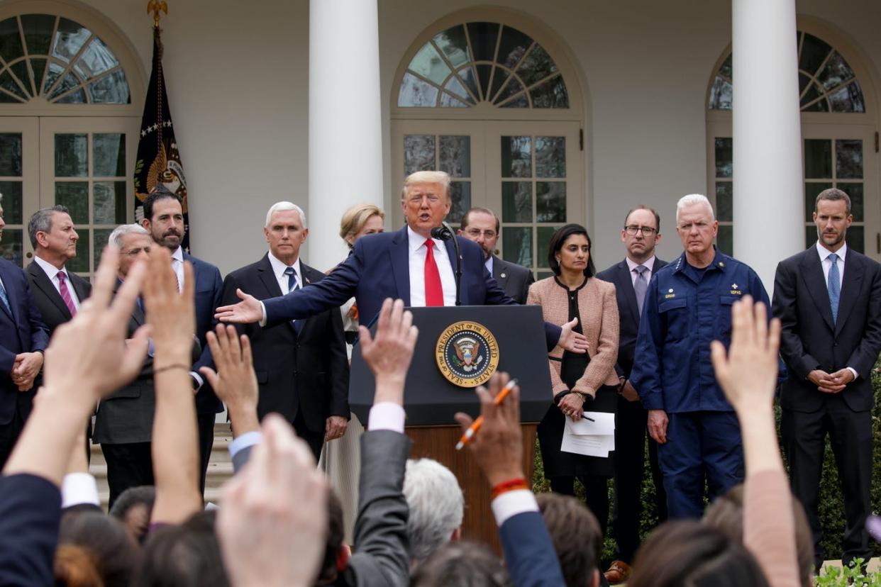 <span class="caption">President Trump at a White House press conference on the pandemic, March 13, 2020.</span> <span class="attribution"><a class="link " href="https://www.gettyimages.com/detail/news-photo/president-donald-j-trump-declares-a-national-emergency-due-news-photo/1207061495?adppopup=true" rel="nofollow noopener" target="_blank" data-ylk="slk:Getty/Yasin Ozturk/Anadolu Agency;elm:context_link;itc:0;sec:content-canvas">Getty/Yasin Ozturk/Anadolu Agency</a></span>