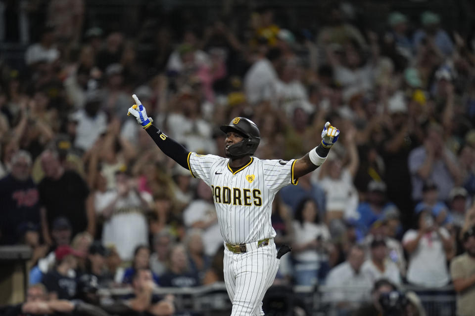 San Diego Padres' Jurickson Profar celebrates after hitting a three-run home run during the eighth inning of a baseball game against the Minnesota Twins, Tuesday, Aug. 20, 2024, in San Diego. (AP Photo/Gregory Bull)