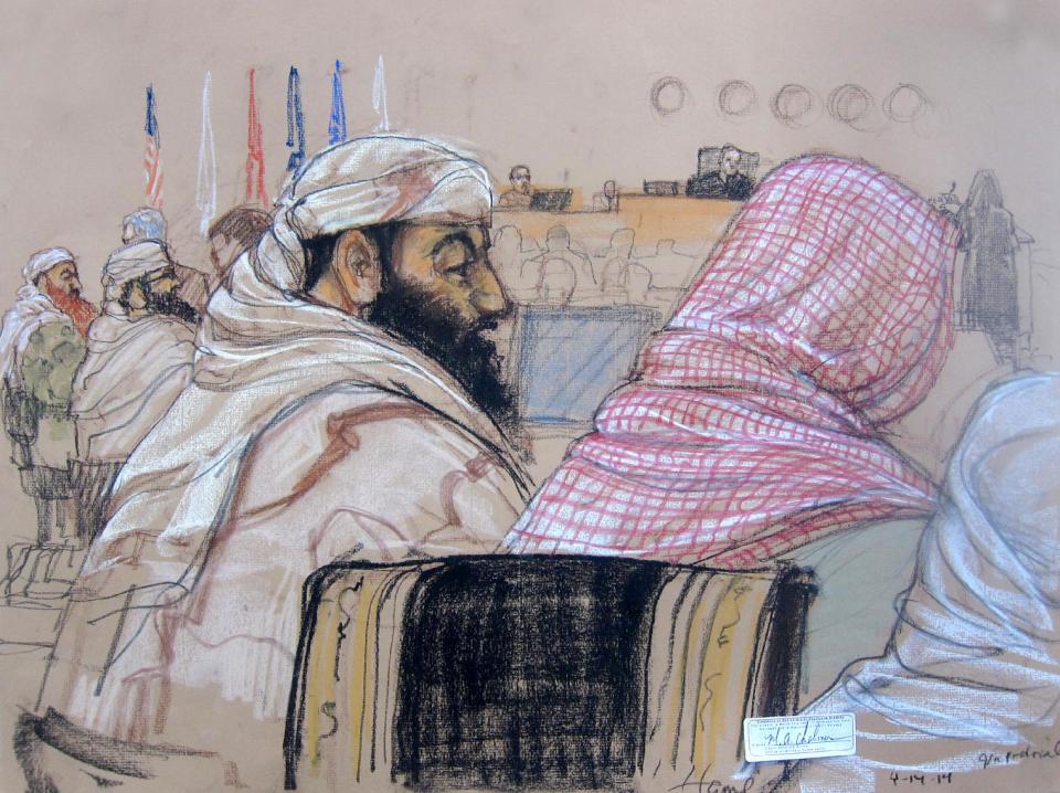 In this pool photo of a Pentagon-approved sketch by court artist Janet Hamlin, defendant Ramzi Binalshibh, center, attends his pretrial hearing along with other defendants at the Guantanamo Bay U.S. Naval Base in Cuba, Monday, April 14, 2014. From right to left are Mustafa al Hawsawi, partially cut off, Ali Abdul Aziz Ali, Ramzi Binalshibh, Walid bin Attash and Khalid Sheikh Mohammad. A lawyer for one of five defendants in the Sept. 11 war crimes tribunal said Monday that FBI agents questioned a member of his defense team, apparently in an investigation related to the handling of evidence, a revelation that brought an abrupt halt to proceedings. The disclosure came at the start of what was supposed to be a mental competency hearing for Harrington's client, Ramzi Binalshibh, a Yemeni accused of providing logistical support to the Sept. 11, 2001, terrorist plot. (AP Photo/Janet Hamlin, Pool)