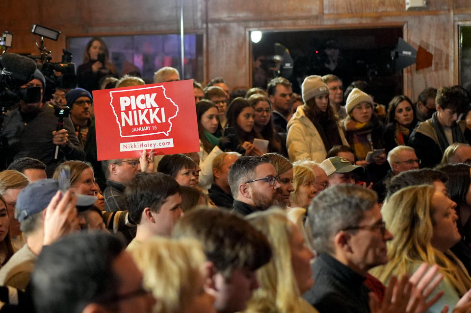 An audience looks on as Republican presidential candidate former UN Ambassador Nikki Haley speaks during a campaign event at Jethro's BBQ in Ames, Iowa, Sunday, Jan. 14, 2024. (AP Photo/Carolyn Kaster)