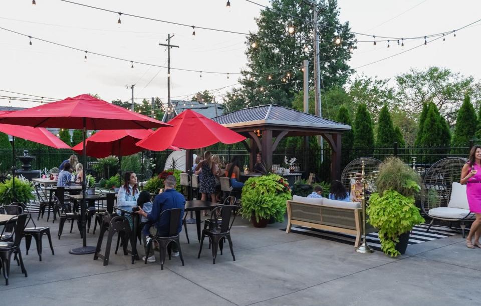An expansive, welcoming patio area invites you to stay for drinks or dinner with friends at Social at the Stone House.