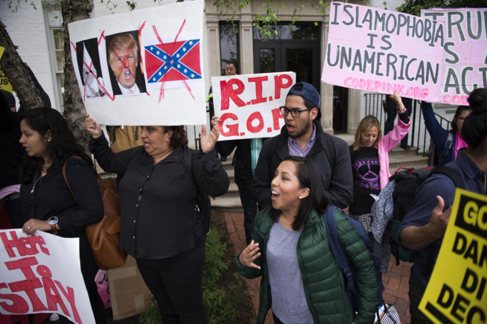 A self proclaimed undocumented immigrant, members of United We Dream and members of Code Pink protest outside the Republican National Committee building in Washington, D.C., May 12, 2016. (Shawn Thew/EPA)