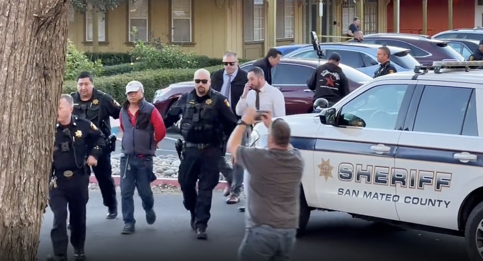 Chunli Zhao being arrested on Monday in the parking lot of the Sheriff’s Office Half Moon Bay as a suspect for the mass shooting earlier that day. (Kati McHugh)