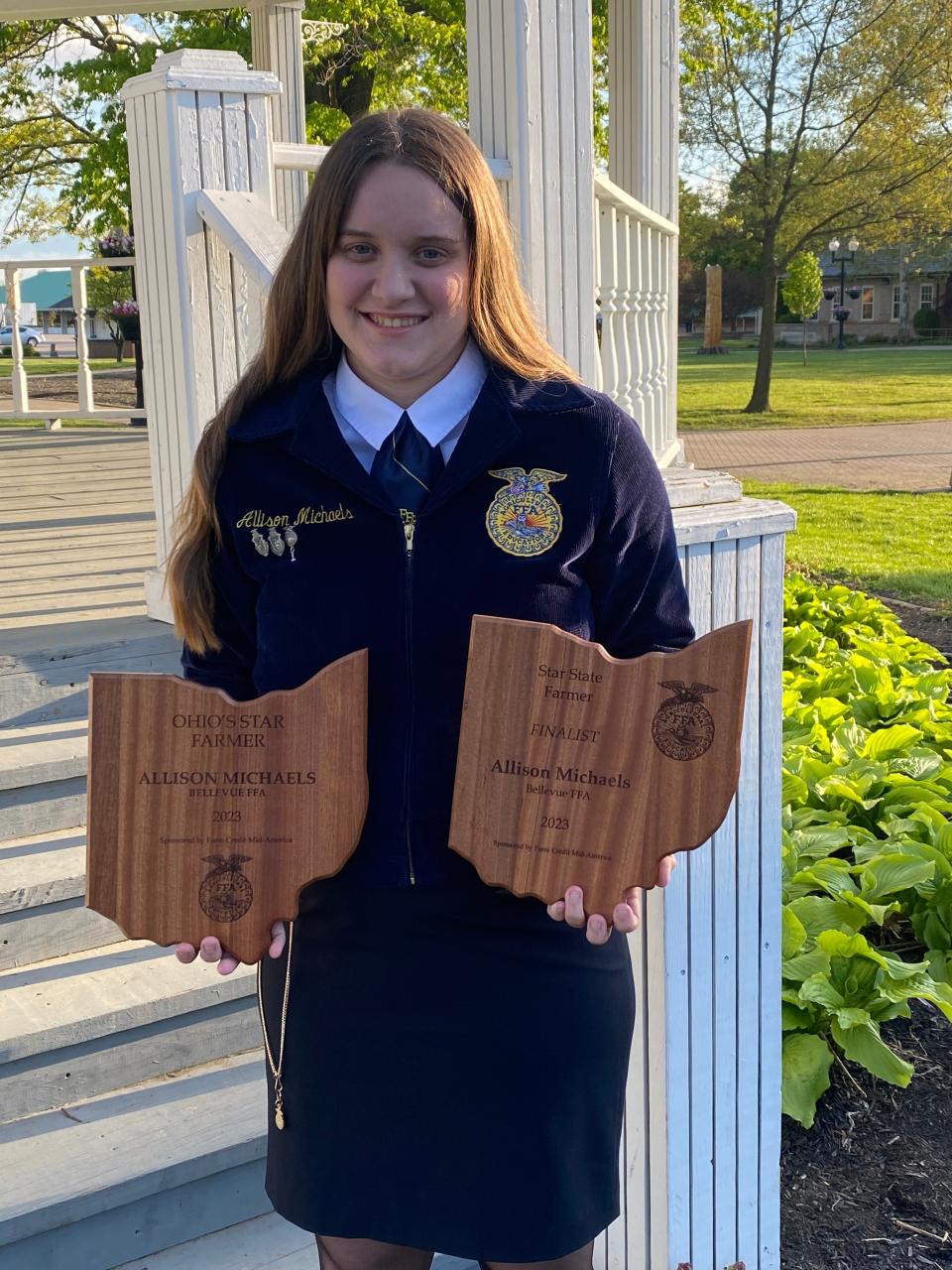 Allison Michaels holds two of her FFA awards.