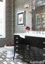 <p>In an opposites-attract powder room, a shared palette prevents the glam leopard-print wallpaper and pharmacy-style metal vanity from clashing. The distressed mirror with coral-pink streaks doesn't see daily use, so it serves mostly to inject color into the bold but limited color scheme.</p>