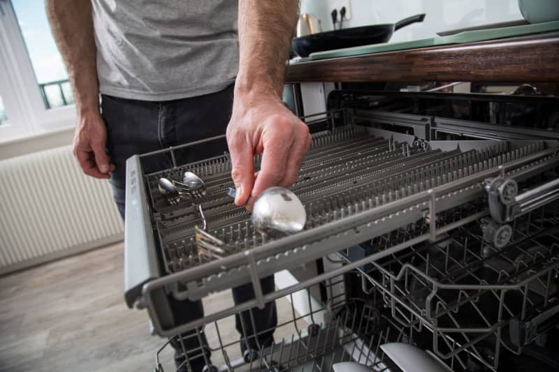 Brown stains appearing on your cutlery after a dishwasher cycle could be a sign of rust film caused by other items. The good news is the brown spots are not permanent and can be easily avoided. Christin Klose/dpa