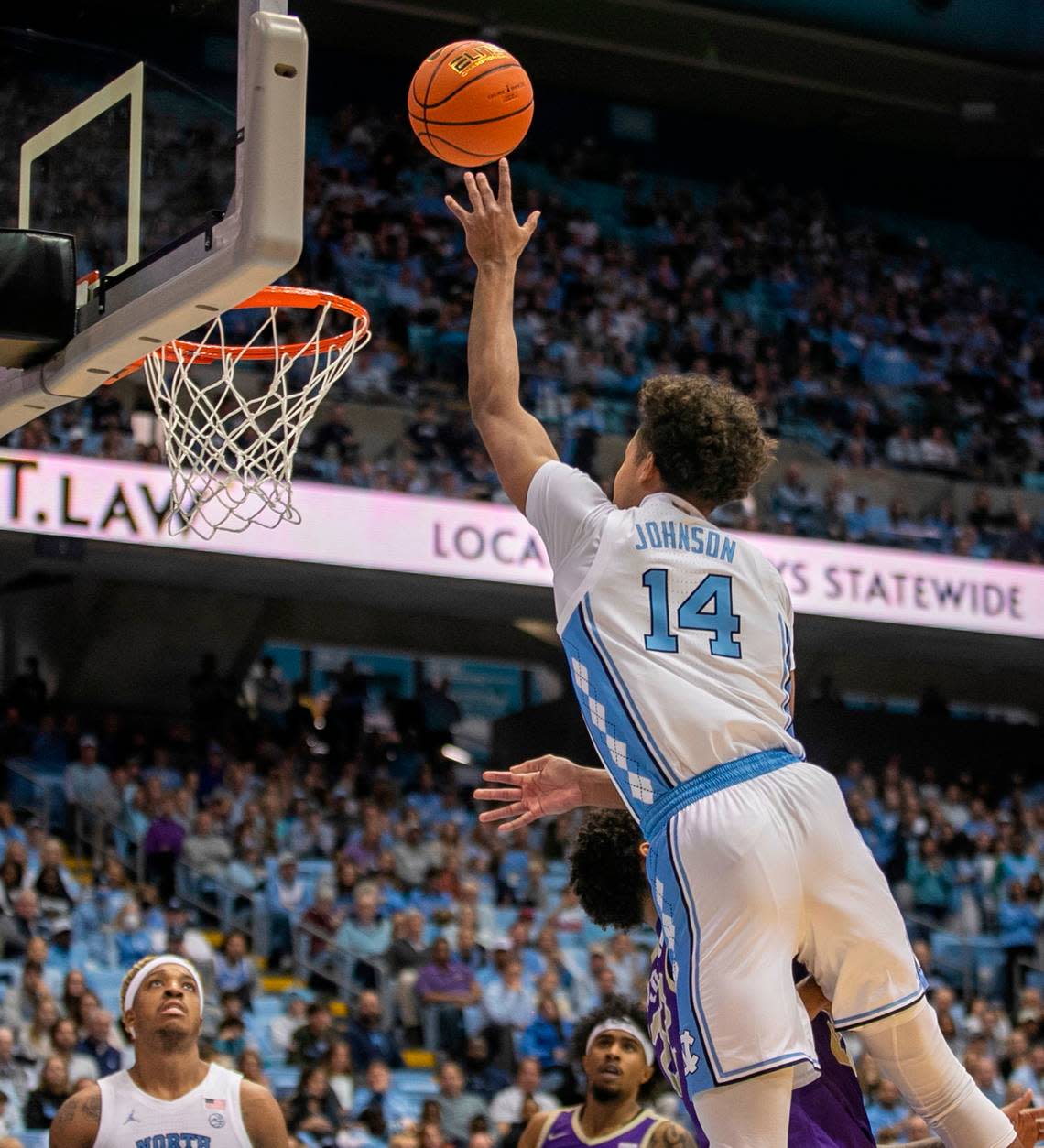 North Carolina’s Puff Johnson (14) puts up a shot in the second has against James Madison on Sunday, November 20, 2022 at the Smith Center in Chapel Hill, N. C. Johnson saw his first action of the season against James Madison.