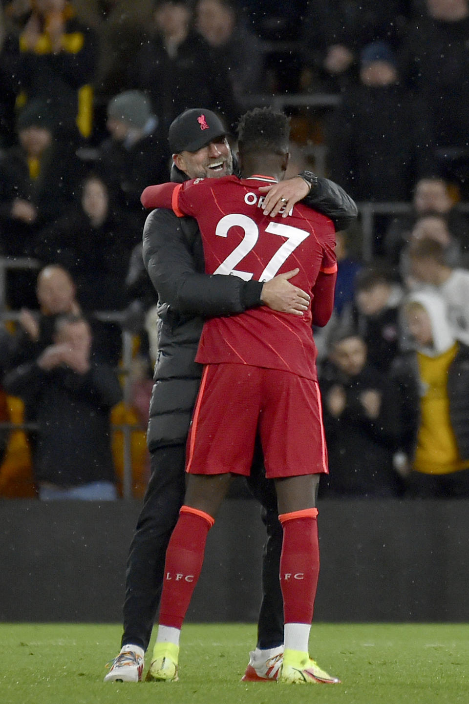 Liverpool's manager Jurgen Klopp hugs Liverpool's Divock Origi at the end of the English Premier League soccer match between Wolverhampton Wanderers and Liverpool at the Molineux Stadium in Wolverhampton, England, Saturday, Dec. 4, 2021. Origi scored the only goal of the match. (AP Photo/Rui Vieira)