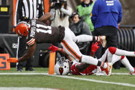 Cleveland Browns wide receiver Donovan Peoples-Jones (11) dives in to the end zone for an 11-yard touchdown as Arizona Cardinals cornerback Robert Alford (23) can't make the tackle during the first half of an NFL football game, Sunday, Oct. 17, 2021, in Cleveland. (AP Photo/Ron Schwane)