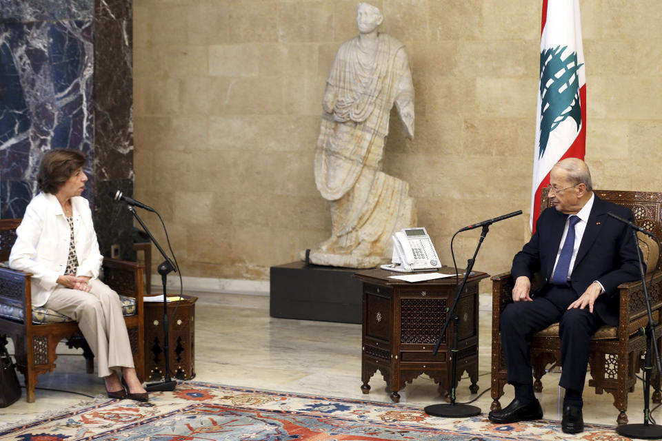 In this photo released by Lebanon's official government photographer Dalati Nohra, Lebanese President Michel Aoun, right, meets with French Foreign Minister Catherine Colonna at the presidential palace in Beirut, Lebanon, Friday, Oct. 14, 2022. Colonna is in Beirut to meet with Lebanese officials. (Dalati Nohra via AP)