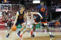 Illinois's Matthew Mayer (24) drives against Wisconsin's Connor Essegian (3) during the first half of an NCAA college basketball game, Saturday, Jan. 28, 2023, in Madison, Wis. (AP Photo/Andy Manis)