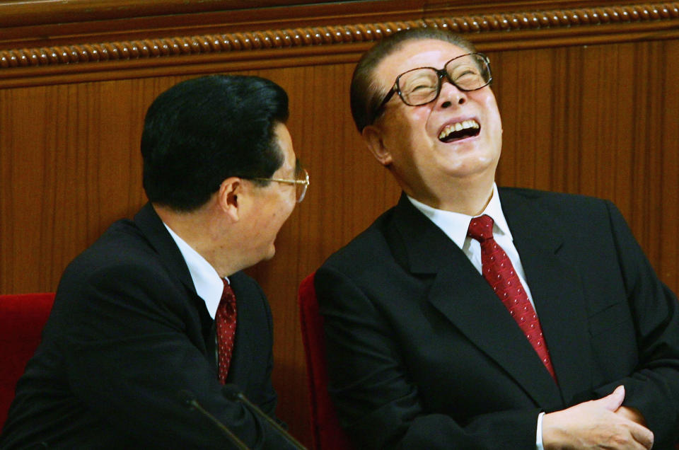 BEIJING - SEPTEMBER 03:  Chinese President, Hu Jintao, (L) talks with former President, Jiang Zemin, during a meeting marking the 60th anniversary of the victory of China's Resistance War Against Japanese Aggression on September 3, 2005 in Beijing, China.  (Photo by Andrew Wong/Getty Images)