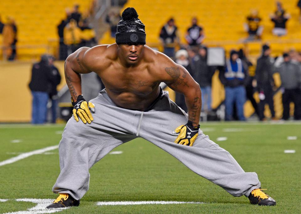 Pittsburgh Steelers outside linebacker James Harrison stretches during warm ups before a game against the Baltimore Ravens in Pittsburgh on Dec. 10, 2017.