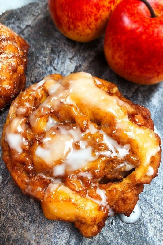 <p>Cake Whiz</p><p>Old fashioned, quick and easy apple fritters recipe with vanilla glaze, homemade with simple ingredients in 30 minutes. Loaded with apples and cinnamon. </p><p><strong>Get the recipe: <em><a href="https://cakewhiz.com/apple-fritters-recipe/" rel="nofollow noopener" target="_blank" data-ylk="slk:Apple Fritters;elm:context_link;itc:0;sec:content-canvas" class="link ">Apple Fritters</a></em></strong></p>