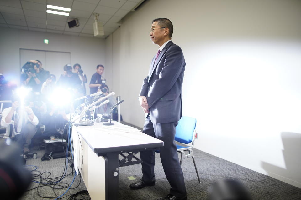 Nissan Motor Co. President and Chief Executive Officer Hiroto Saikawa faces the glare of media lights during a press conference at Nissan Motor Co. Global Headquarter Monday Nov. 19, 2018, in Yokohama, near Tokyo. Saikawa said Monday that Nissan Chairman Carlos Ghosn, who helped turn around the carmaker over two decades, has been arrested and will be dismissed for allegedly under-reporting his income and misusing company funds. (AP Photo/Shuji Kajiyama)