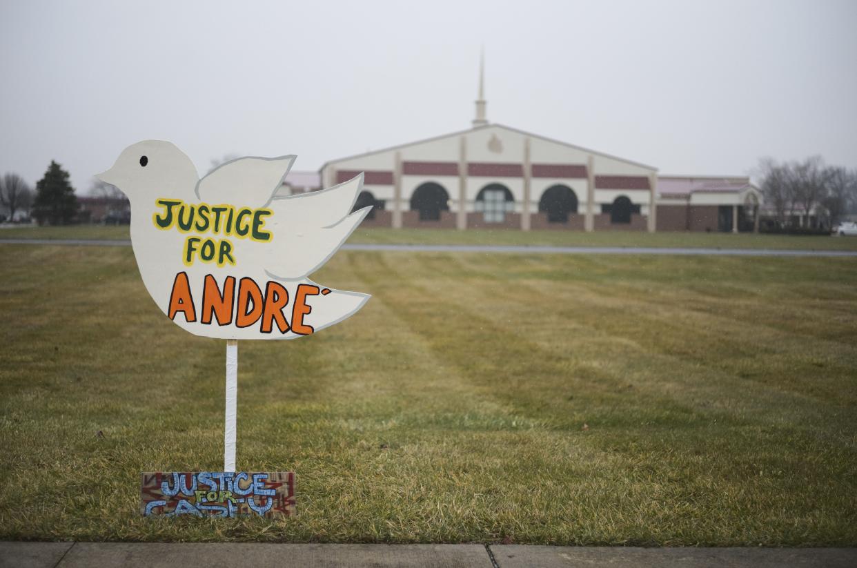 Signs reading "Justice for Andre'" and "Justice for Casey," in reference to Andre' Hill and Casey Goodson Jr., both Black men killed at the hands of law enforcement in Columbus, sit outside the First Church of God before the funeral of Andre Hill on Jan. 5, in Columbus, Ohio. 