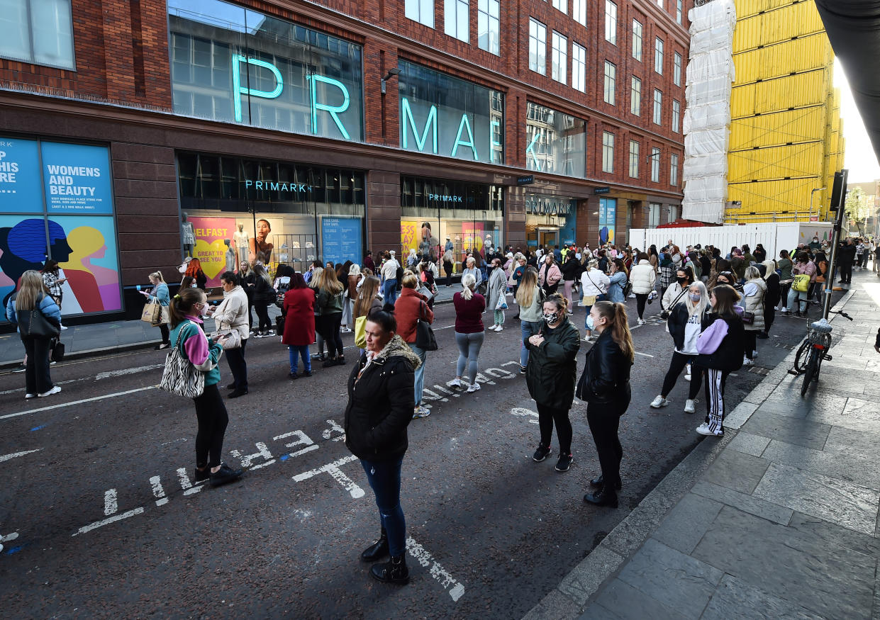 BELFAST, NORTHERN IRELAND - APRIL 30: Thousands of shoppers wait for Primark to open for the first time since the latest lockdown on April 30, 2021 in Belfast, Northern Ireland. Non essential retail shops and bars with outdoor facilities reopen today in the province as Covid-19 restrictions are eased. (Photo by Charles McQuillan/Getty Images)