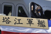 Taiwan's President Tsai Ing-wen gives a "thumbs up" on the domestically made Tajiang warship during its commissioning ceremony at the Suao naval base in Yilan county, Taiwan, Thursday, Sept. 9, 2021. Taiwan's president oversaw the commissioning of a new domestically made navy warship Thursday as part of the island's plan to boost indigenous defense capacity amid heightened tensions with China. Chinese characters read "Ta Jiang Warship." (AP Photo/Chiang Ying-ying)