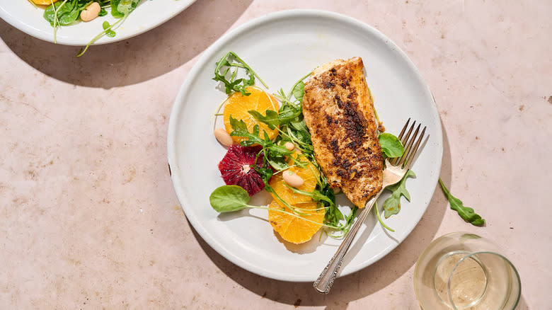 citrus and fish on plate