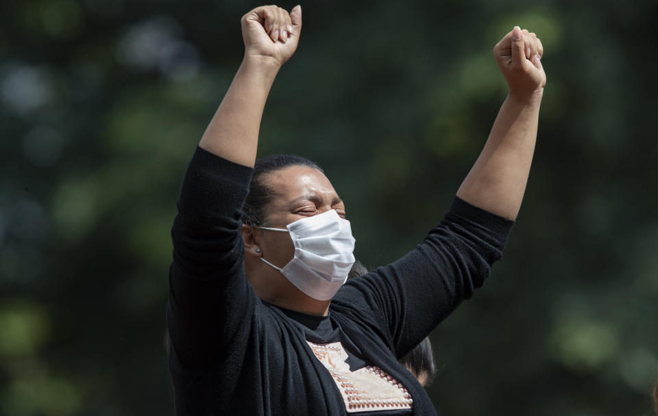 A woman grieves during the burial of a relative who died from complications related to COVID-19 at the Vila Formosa cemetery in Sao Paulo, Brazil, Wednesday, April 7, 2021. (AP Photo/Andre Penner)